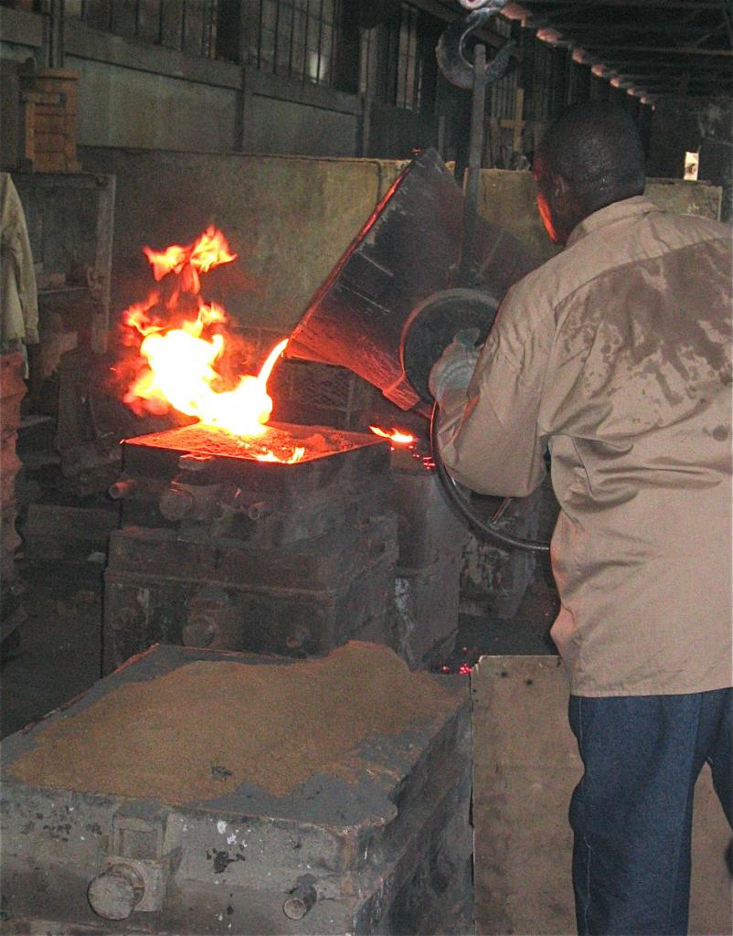 Pouring molten bronze