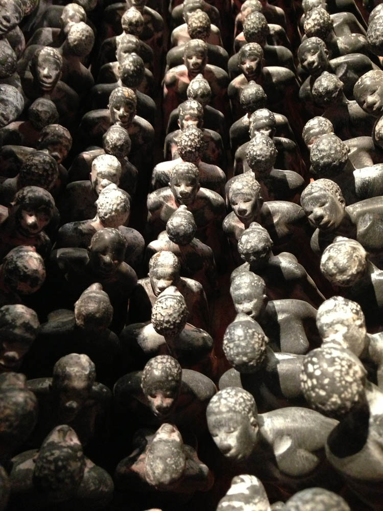 THEIR SPIRITS GONE BEFORE THEM, detail, 2006, cottonwood canoe, 16’; 1357 resin figures, sugar cane
